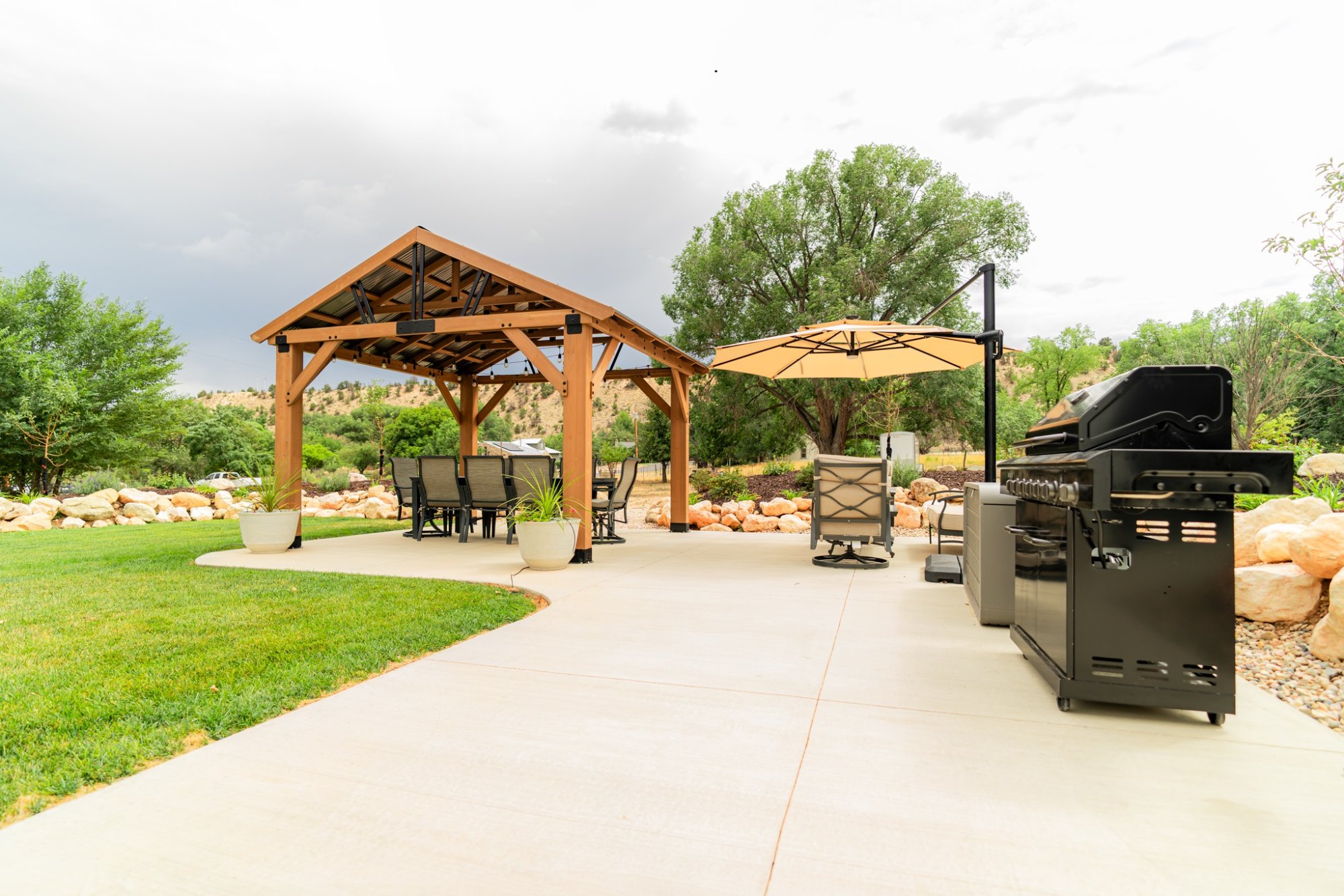 Backyard pergola with BBQ grill